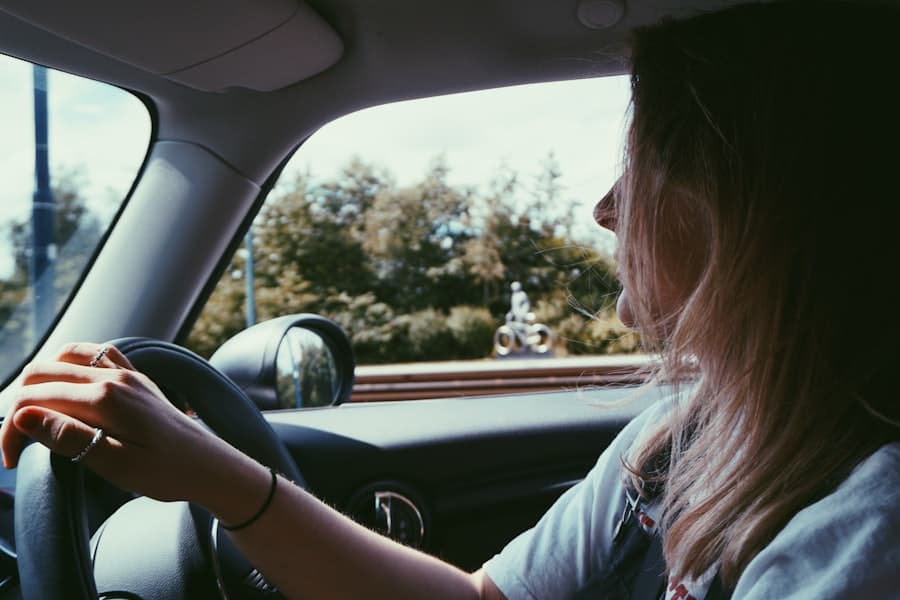 Learner driver's view from the driving seat, hands on the wheel, looking out at the road ahead